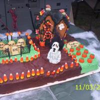 Ginger's Halloween Cake 2007 My daughter, Theresa and I had fun making the haunted house together then we used it to top the cake for Ginger's Party. Candy accents...