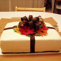 Birthday Cake ~ Man Made this cake for an older gentleman with a late October birthday. Icing is buttercream, bow is chocolate Satin Ice fondant, flowers are...