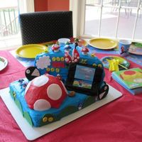Mario / Nintendo Ds Cake BC icing with fondant accents, mario and luigi toys for the birthday boy. RKT DS covered in fondant. This was my very first time even...