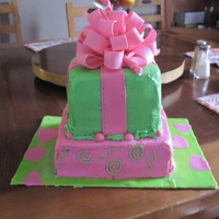 Gift Box Cake My first bow...much tougher cake than expected due to time constraints and very odd acting buttercream and an unusually heavy top tier. But...