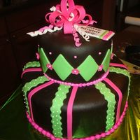 Pink And Green Cake This was for a 13 year old girl. The bow, stripes and diamonds are all fondant. It's chocolate cake, chocolate ganach and chocolate...