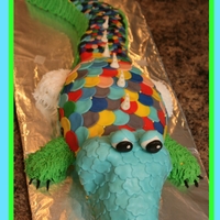 Rainbow Alligator 30 inches long! Vanilla and chocolate with fondant scales and BC on the sides.