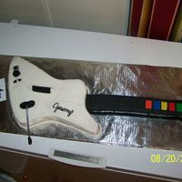 1St Guitar Hero Cake This is the 1st guitar cake I have ever attempted. My first cousin's son was celebrating his 20th birthday and my cousin asked me to...