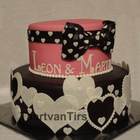 Heart All Over Top tier is covered with marzipan, bottom tier is covered with a mixture from chocolate RTR fondant and marzipan. All the white decoration...
