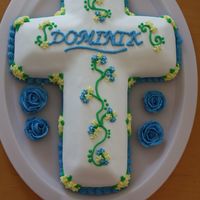 Cross Cake This cake was actually for a baptism. I used the Wilton Cross pan and covered it in MMF and BC accents.