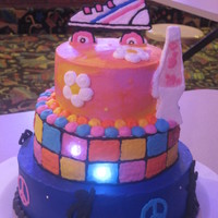 70S Cake This cake was for a girl who was having a 70's themed skate party! She was so cute all dressed up in an afro! hah! She had 3 things...