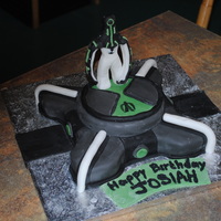 Ben 10 Omnitrix Cake This is a Ben 10 omnitrix cake for my sons 7th birthday. His favorite alien is Upgrade so I made one out of fondant. Fondant covered cake w...
