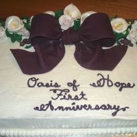 Church Anniversary Cake This is a BC with fondant and gumpaste accents. Loved doing this cake. First time working with the gumpaste ( lilies and roses) had a great...