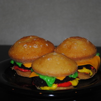Cheeseburger Cuppiecakes! I love love love these. So cute and sooo easy to make. The "buns" are yellow cupcakes, the "patties" are chocolate...