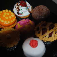 Dessert These are dessert cupcakes I did for a party. We have cherry pie, pumpkin pie, a variety of little cakes and a icecream sundae. Sorry the...