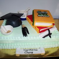 Marshall Graduation This cake was for a Marshall graduate. His degree is in Chemistry. The mortar & pestel, beaker, and cap are all made out of fondant and...