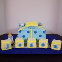 Baby Shower Gift White cake with buttercream and fondant accents. Building block are RKT covered with fondant.