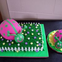 Pink And Green Ladybug This cake was for a child's first birthday. The big ladybug is cake covered in MMF on top of another cake with fondant accents. The...