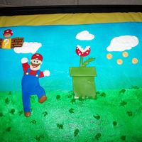 Mario The client that wanted this cake did not want a 3D cake, so we make a 2D cake with Mario and other accents out of MMF.