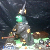 Witchie Poo.... This cake is almost entirely edible. The head and legs are made from rice crispies and marshmallows. The cemetary stones and skulls are...