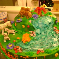 Jungle Buttercream with plastic animal figurines on top, later I added palm trees as well
