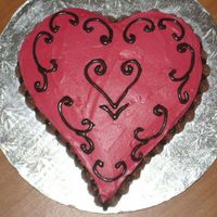 Buttercream Icing Covered Heart Cake filled with rasp. mousse...