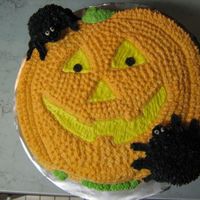 Creepy Jack Jack-O-Lantern with cream cheese frosting and 2 cups used to make spiders