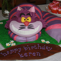 Cheshire Cat Sculpted vanilla caramel cake with butter cream and MMF accents. A lot of fun to make!!