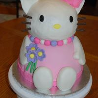 3D Hello Kitty The base of this cake (wilton wonder mold ontop of 8" round) was covered in MMF, Hello Kitty's head is BC (wilton ball mold,...