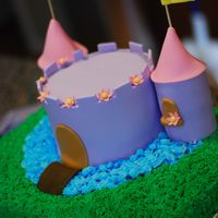 Princess Castle The final cake included the Disney princesses, this pic was taken before they were added. The towers were stacked cupcakes and the cake is...