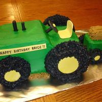 John Deere Tractor This cake is all carved out of pound cake, covered in BC with MMF accents.