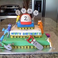 Handy Manny Birthday Cake This is my son's 2nd birthday cake. The cake is covered in MMF (Rhonda's ultimate) with gumpaste hat and measuring tape. I formed...
