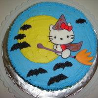 Witch Hello Kitty Cake Buttercream covered vanilla cake with royal icing Hello Kitty.