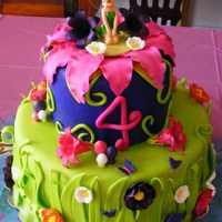 Tinkerbell First time playing around with gumpaste flowers...Too Much Chocolate cake with Chocolate fudge buttercream. A huge hit!