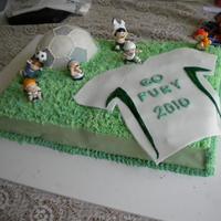 Soccer Ball And Jersey Half sheet cake, with soccer ball. Fondant sides, soccer ball, and jersey. Plastic soccer players (my mom had to have them, I thought they...