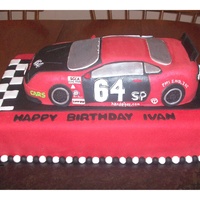 Race Car Birthday Cake My husband and I made this birthday cake for his boss, who races cars as a hobby. Everything is edible! The car is made from cake and...