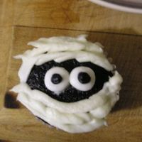 Mummy Cakes - My First Try I'm brand new to cake decorating. These "mummy" cupcakes are one of my first attempts at decorating. Not much skill involved...
