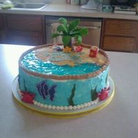 Beach Birthday Everything on the cake is edible, the decorations are made of fondant. The water on top is made with piping gel.Vanilla White Cake, vanilla...