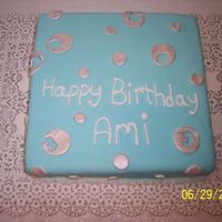 Square With Silver 3 chocolate fudge cake with chocolate carmel filling. fondant and silver panted with luster dust