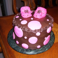 Baby Shower Cake Strawberry cake with strawberry filling with dark choc. buttercream. Cupcake & buttercream booties. First attempt at the booties but...