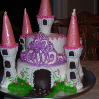 Audrie's Castle WASC, w/ cookies & cream filling, buttercream frosting & most decorations. Rolled buttercream wrapped ice cream cones for turret...