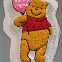 Winnie The Pooh My first character cake for my daughter's bday. Used Wilton Winnie the Pooh cake pan, BC frosting