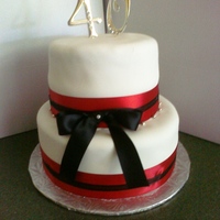 40Th Red Anniversary The centerpiece cake of a three-cake display. Had trouble with bulges on this one, which I haven't had before. Red Velvet cake to...