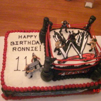 Wrestling Wwe Birthday Cake birthday cake for an 11 year old boy. Everything is edible except for the figures. The ropes are licerice and the poles are cherry sticks...