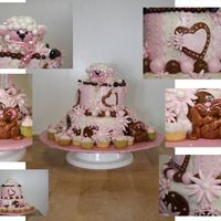 Baby_Shower_11-01-08.jpg baby shower cake with fondant lamb and rabbit - then airbrushed with the pearl effects - also included mini cupcakes that have fondant...