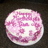 Pink Flowers White velvet cake with vanilla frosting and fondant flowersThanks for looking!