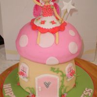 The Mushroom Fairy Modelling paste fairy with paper wings. Mushroom in fondant with gumpaste trims.