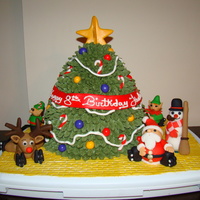 Christmas Birthday Cake This cake is for a birthday party at a roller rink. The birthday girl wanted a Christmas themed cake since her birthday is in December. All...