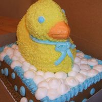 Duck In Water Duck is choco. cake with buttercream icing.Bottom is 2- 9 x 13 sheet cake-yellow cake w/ buttercream icing.