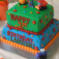 2 Tier 1St Bday Cake W/ Cars On It 2 tier square w/ buttercream icing