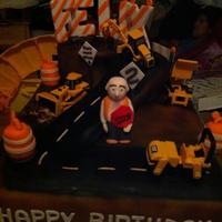 1316320880.jpg chocolate cake chocolate buttercream top tier and side ramp.. vanilla cake vanilla buttercream 1/2 sheet. everything is handmade fondant...