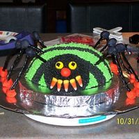 Emelia's Birthday Spider Yellow cake using sports ball pan, buttercream stripes and on head. Head was made using small pyrex bowl. Legs are black licorice jointed...