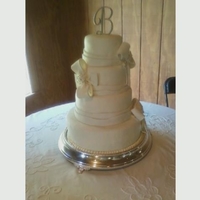 Fondant Wedding Cake sour cream pound cake with satin ice fondant. first time making the bows. My daughter made them and I think she did a great job.