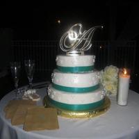 Crystal's Wedding Cake cake was transported and put together by my daughter. ribbon with buttercream icing. for a beach wedding.