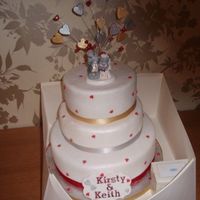 Hearts Wedding Cake 3 tier white wedding cake with hearts on and a heart spray including me to you bears